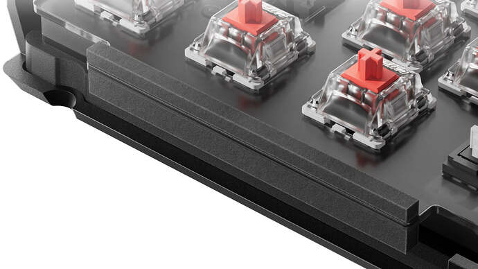 Close-up of the gasket mount and plate layer inside a Keychron V6 Max, with switches seated in the plate above the foam