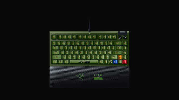 Colour accents on the right of the board: a yellow-orange up arrow key, with blue, green and red keys below it