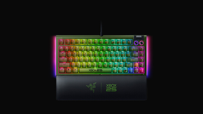Razer BlackWidow V4 75% Xbox 25 Anniversary Edition lit up in green, with XBOX25 printed on the spacebar
